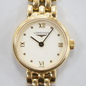 A lady's 2001 18ct gold Longines quartz wrist watch, on an 18ct gold Longines bracelet, overall