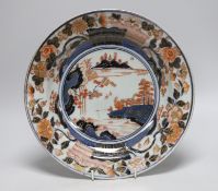 A Japanese Arita dish, late 17th century, painted in Imari palette, stilt marks, cracked, 28cms