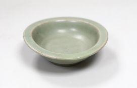 A Chinese Longquan celadon dish, Song-Yuan dynasty, 12cm. Provenance - Dr H. Ginsburg collection