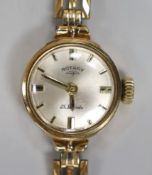 A lady's 9ct gold Rotary manual wind wrist watch, on associated 9ct gold bracelet, overall 17cm,