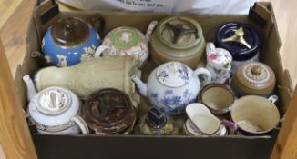 A quantity of various teapots, jugs and biscuit barrels including Ironstone, Doulton etc.