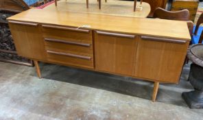 A mid century design teak sideboard, length 182cm, depth 47cm, height 79cm and extending dining