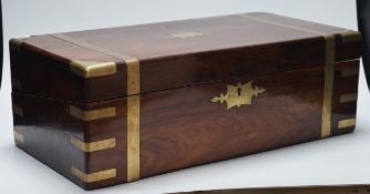 A 19th century brass bound rosewood writing slope, engraved inset to lid. 50cm wide