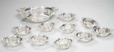 A set of ten Canadian Birks pierced sterling nut dishes, 97mm and a similar larger dish, 20.8cm,