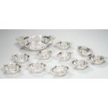 A set of ten Canadian Birks pierced sterling nut dishes, 97mm and a similar larger dish, 20.8cm,