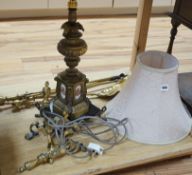 A brass table lamp and various fire implements