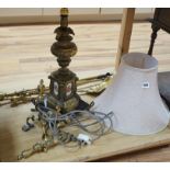 A brass table lamp and various fire implements