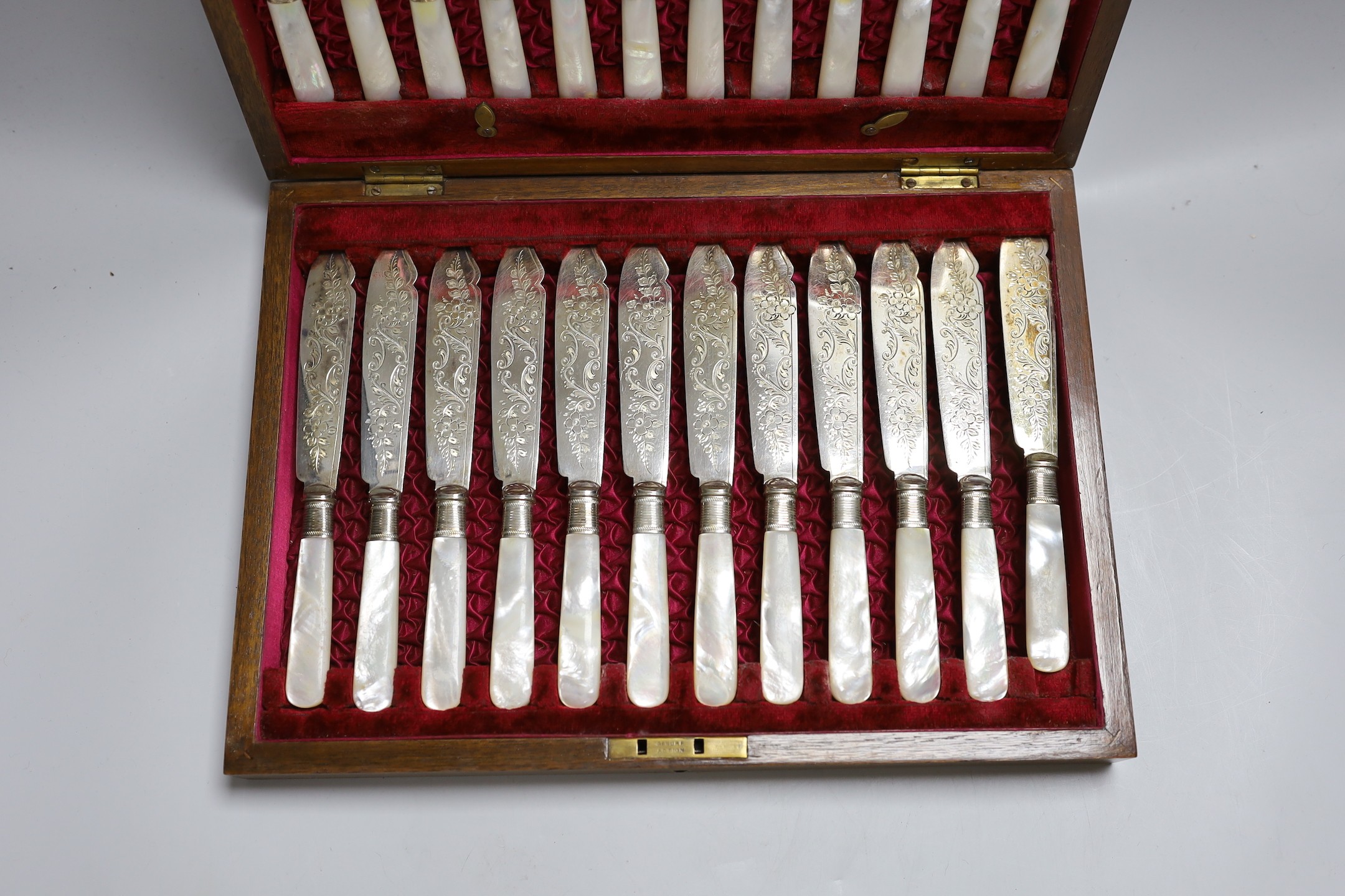 Twelve pairs of silver plated fish knives and forks with mother of pearl handles, in wooden canteen - Image 2 of 3