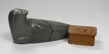 An Inuit stone figure of a seal and a Maori box and cover, carving 22cm long
