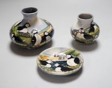 Three boxed Moorcroft ‘Puffin’ ceramics: a squat vase, a smaller vase and a dish, squat vase 11cms