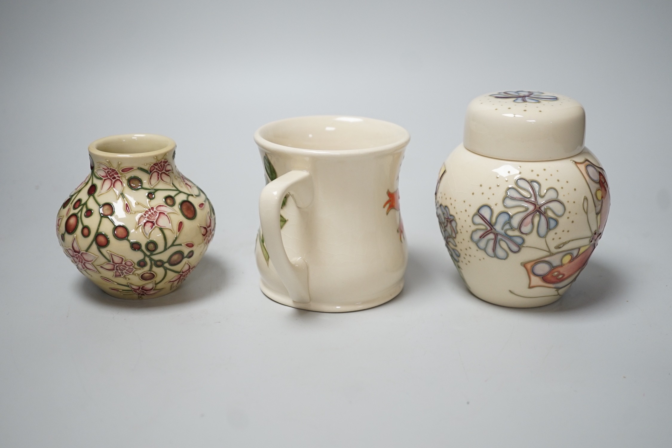 Three boxed Moorcroft pieces; Rose Hip cup, Butterfly jar and cover, and a Fuchsia vase, tallest - Image 3 of 6