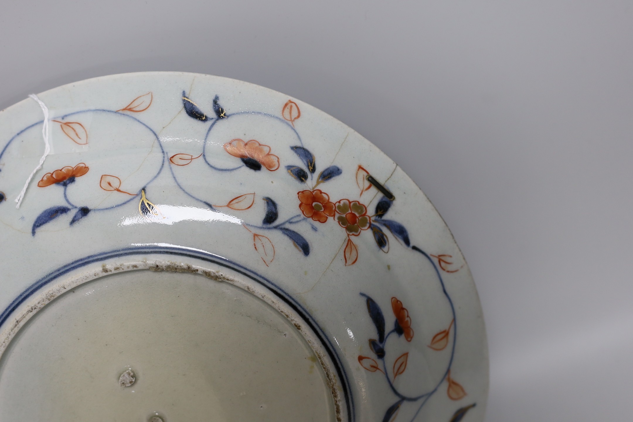 A Japanese Arita dish, late 17th century, painted in Imari palette, stilt marks, cracked, 28cms - Image 4 of 4