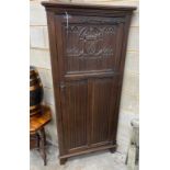 A 17th century style oak linenfold moulded standing corner cabinet, width 83cm, depth 45cm, height