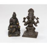 A Japanese Meiji period bronze of a seated figure, inscription to base together with an Indian