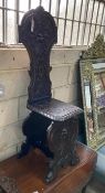 A late Victorian carved fruitwood hall chair, height 118cm