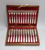 Twelve pairs of silver plated fish knives and forks with mother of pearl handles, in wooden canteen