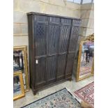 An industrial style metal four door locker, width 123cm, depth 33cm, height 184cm