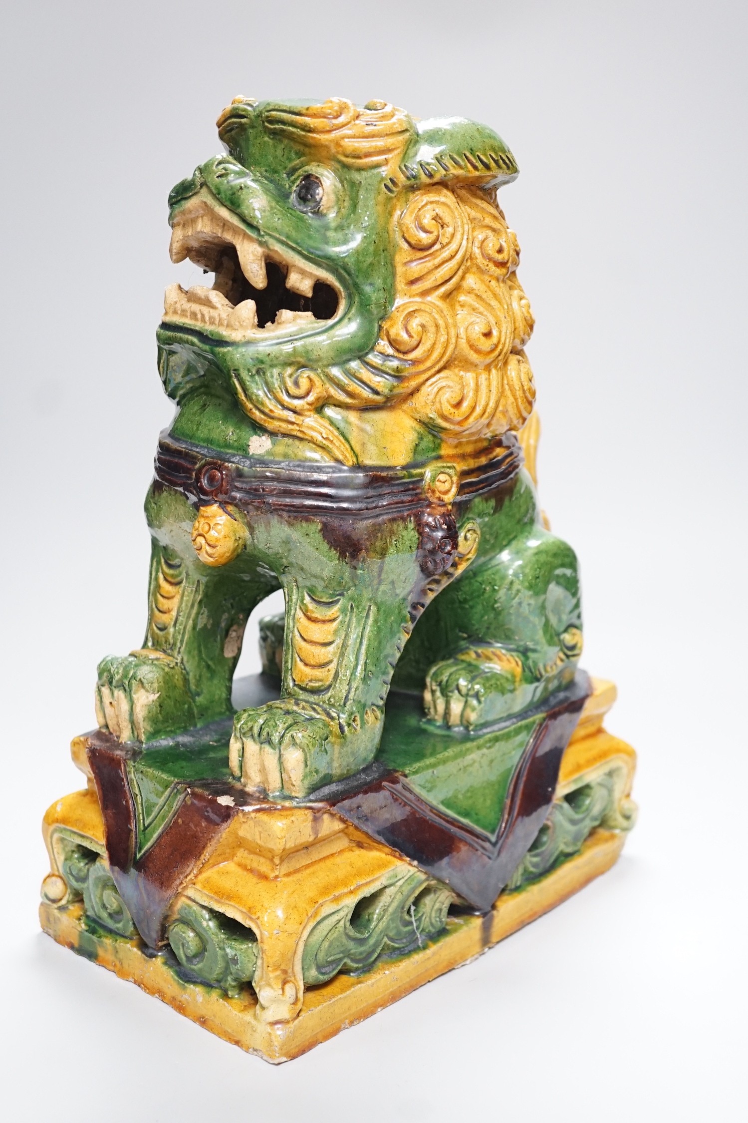 A large Chinese sancai glazed lion dog, 38cms high