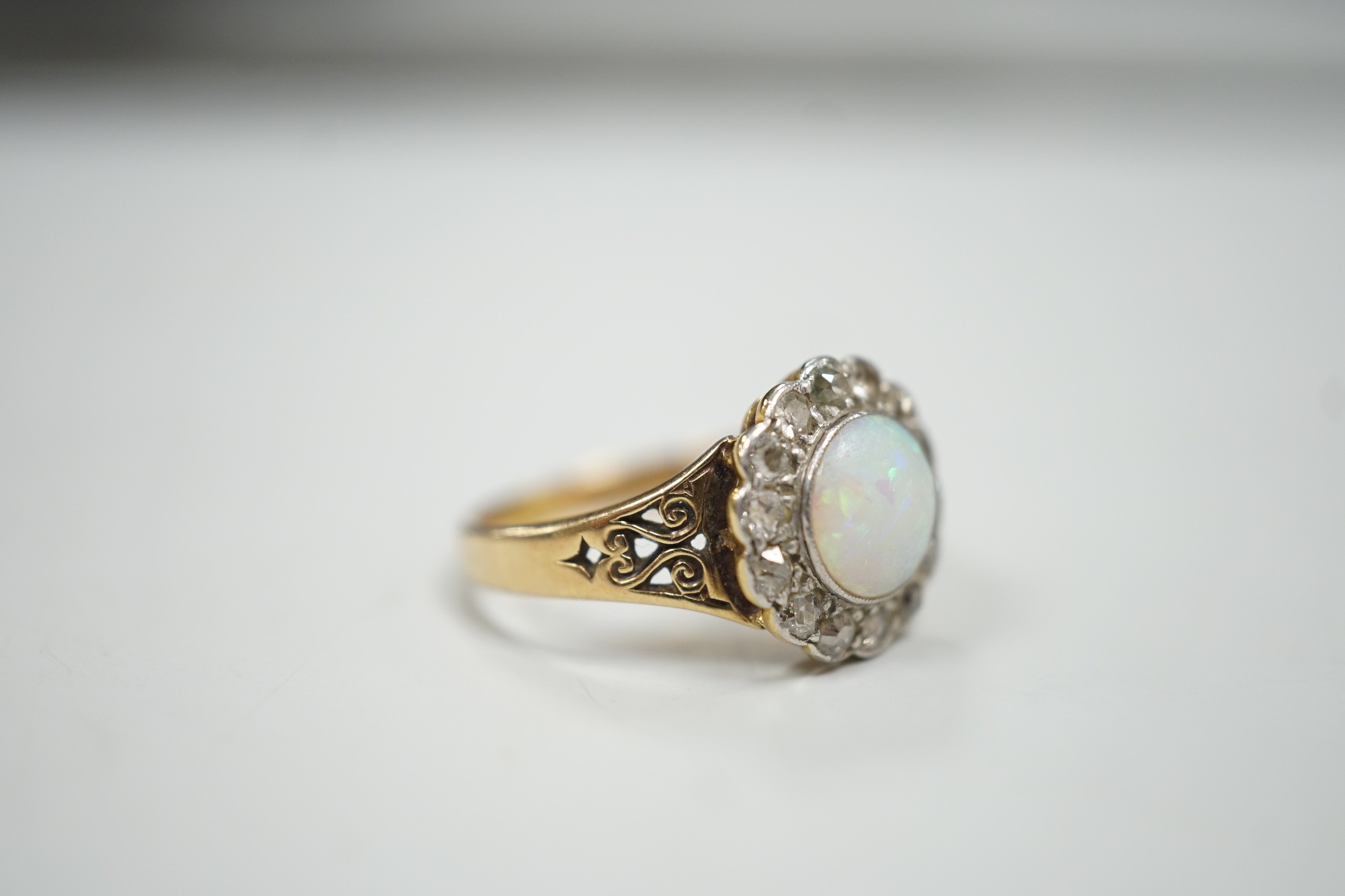 A 1920's? yellow metal, white opal and round cut diamond set circular cluster ring, size O, gross - Image 3 of 4