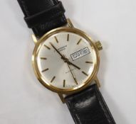A gentleman's yellow metal (Swiss 9ct mark) J.W. Benson automatic day(in French)/date wrist watch,