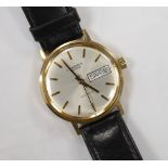 A gentleman's yellow metal (Swiss 9ct mark) J.W. Benson automatic day(in French)/date wrist watch,