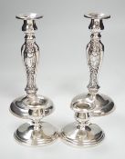 A pair of ornate sterling mounted candlesticks, 20.3cm, weighted and a pair of silver mounted