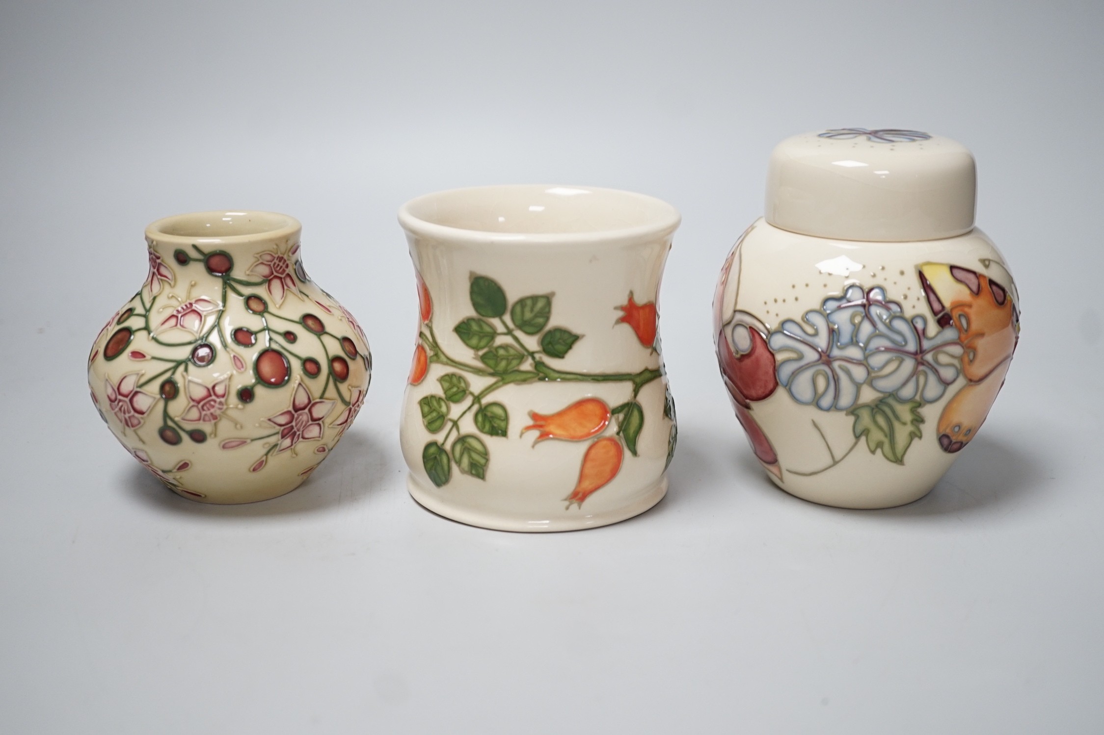 Three boxed Moorcroft pieces; Rose Hip cup, Butterfly jar and cover, and a Fuchsia vase, tallest - Image 2 of 6