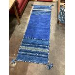 A contemporary flat weave runner 220cm x 70cm