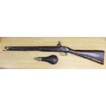 A 19th century percussion cap carbine musket with name stamped to lock plate and a shot flask,