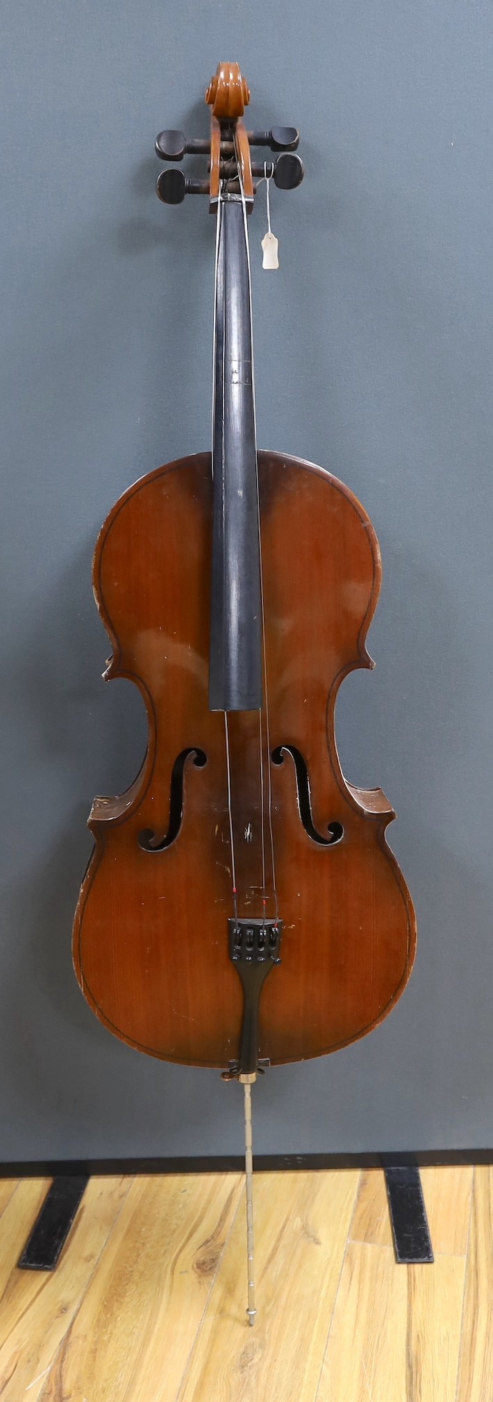 A modern cello, with canvas case