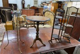 A Victorian style circular tripod games table, diameter 51cm, height 66cm together with three cake