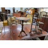 A Victorian style circular tripod games table, diameter 51cm, height 66cm together with three cake