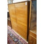 A mid century walnut two door cabinet, by Georg Schoettle, Stuttgart, width 135cm, depth 40cm,