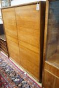 A mid century walnut two door cabinet, by Georg Schoettle, Stuttgart, width 135cm, depth 40cm,
