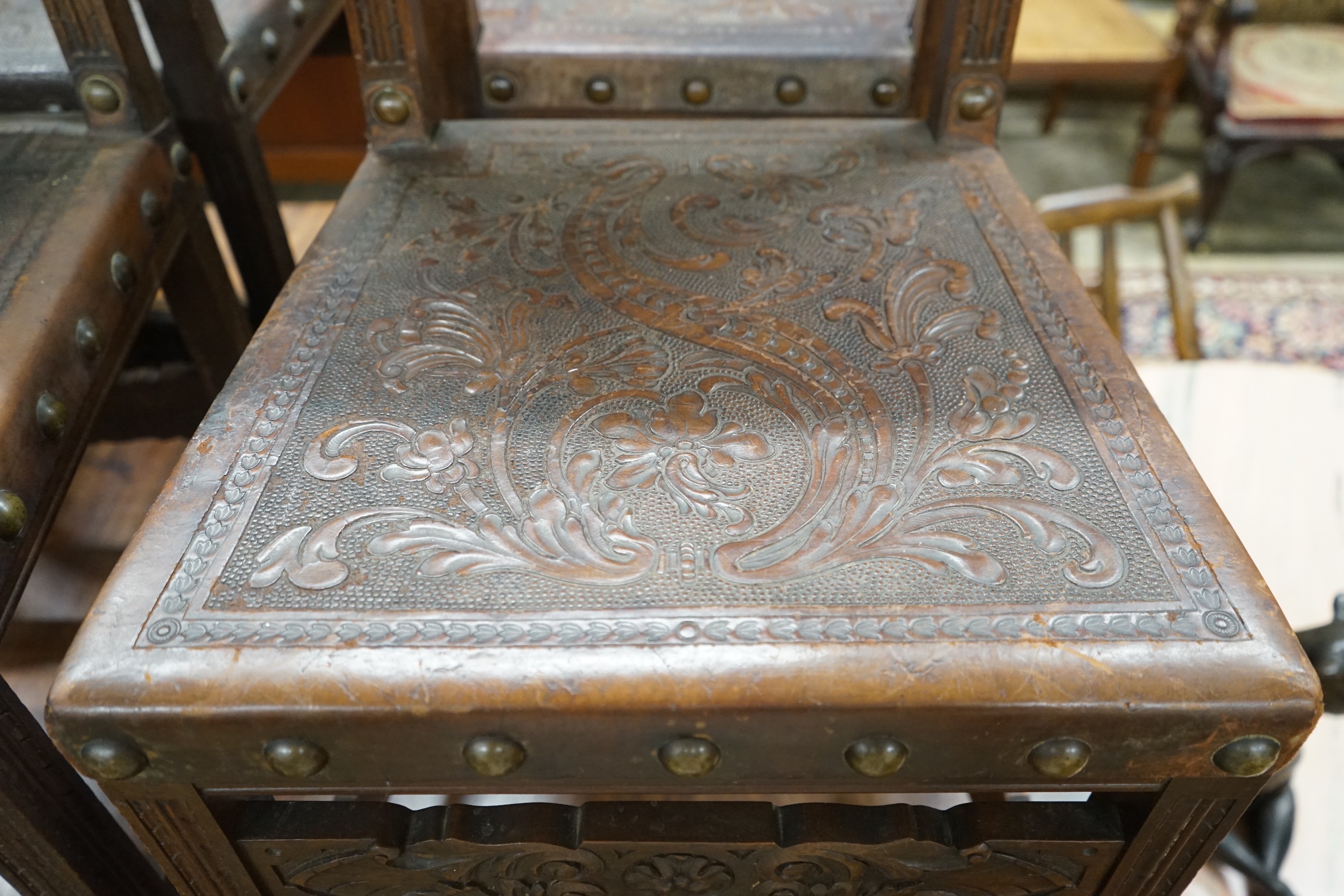 A set of six 18th century style brass studded carved oak and embossed leather dining chairs - Image 3 of 4