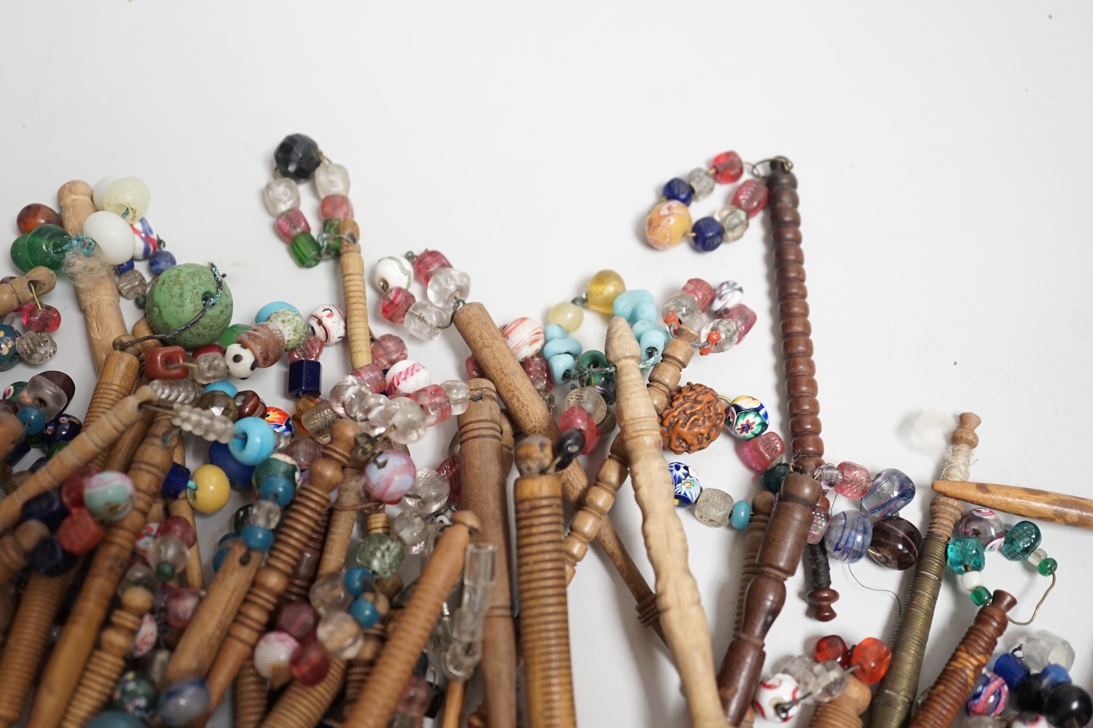 Fifty 19th century finely turned wooden lace bobbins with beaded ends together with 35 ornate wooden - Image 7 of 11