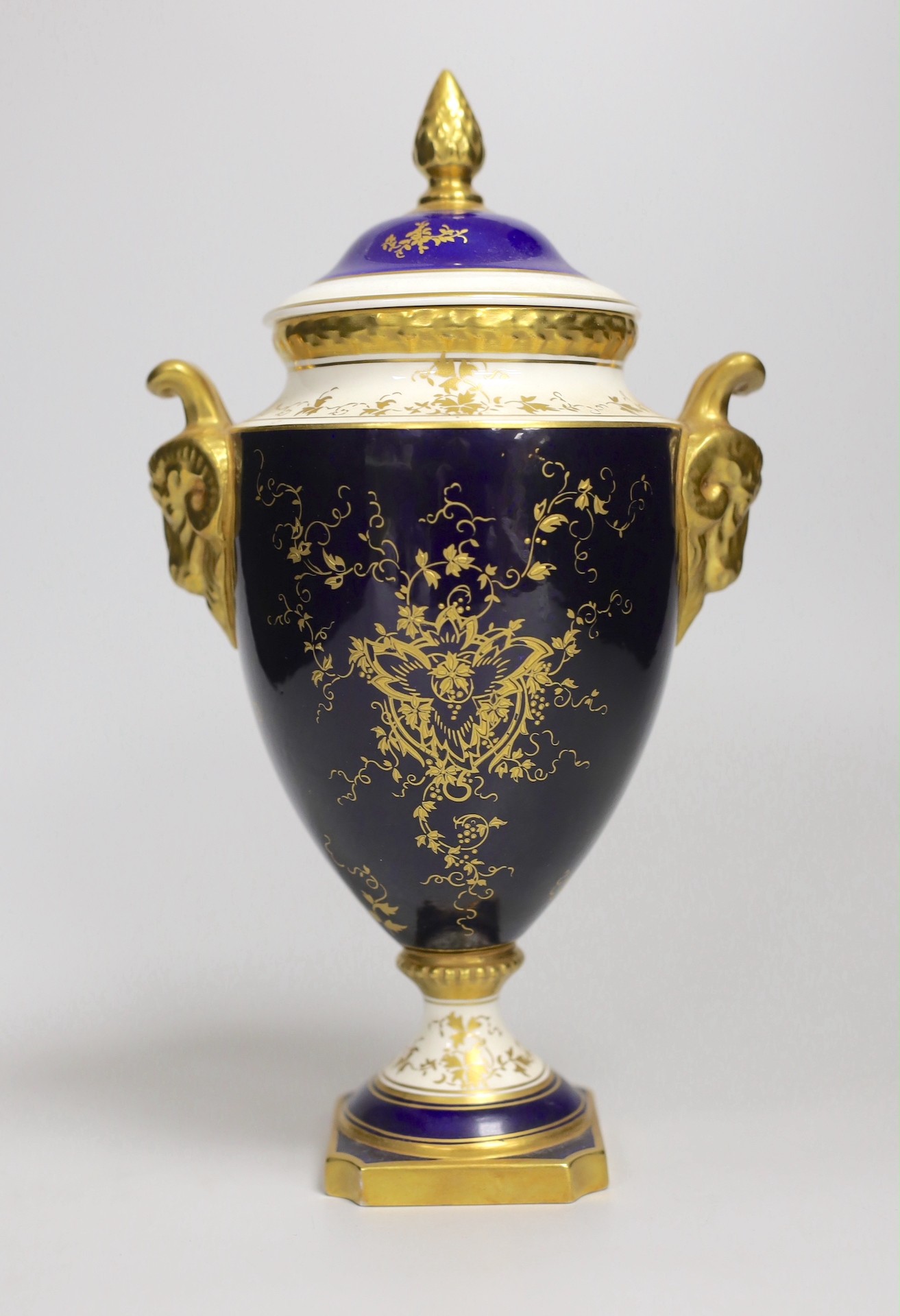 A Coalport urn and cover decorated with a floral reserve on a blue ground, 24cm - Image 3 of 4