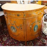 An Edwardian Sheraton revival painted satinwood demi lune side cabinet, width 107cm, depth 52cm,