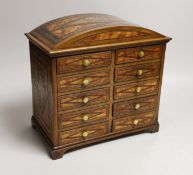 A Sorrento inlaid bird’s eye maple ten drawer miniature chest, 27cms x wide 26.5 cms high