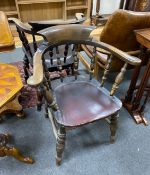 A pair of late Victorian beech and elm smoker's bow elbow chairs, width 67cm, depth 51cm, height