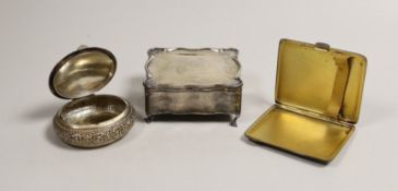 An Edwardian silver trinket box, Birmingham, 1907, 90mm, a silver cigarette case and a Persian?