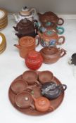 A quantity of Chinese Yixing teapots, a cinnabar resin jar and cover, a Samson teapot etc.