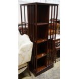 A tall reproduction Edwardian style revolving mahogany bookcase, width 60cm, height 159cm