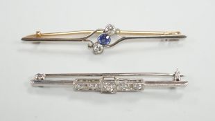 An early to mid 20th century white metal and five stone diamond set bar brooch, 50mm and a similar