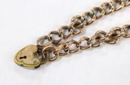A 9ct curb link bracelet with gold plated heart shaped padlock clasp, 19.5cm, gross weight 10.8