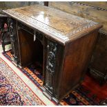 An 18th century carved oak kneehole desk, width 105cm, depth 59cm, height 81cm