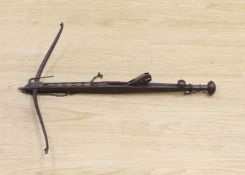 An 18th century English mahogany, brass and iron mounted bullet crossbow, 69cm, pommel end