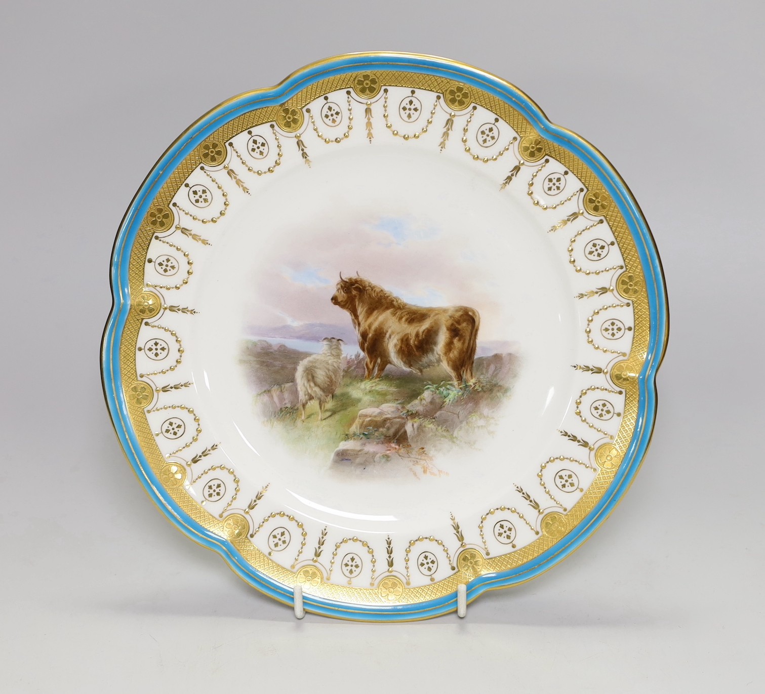 A Minton plate with turquoise, acid etched and raised gilt border painted with a bull and a sheep by