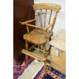 A Victorian elm and beech Windsor comb back child's high chair, height 84cm