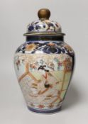 A late 17th/early 18th century Japanese Arita vase and cover, 27cm